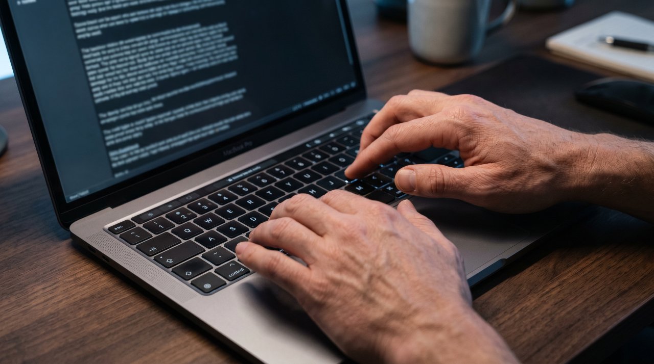 Close-up of a person typing a detailed AI prompt into a text interface